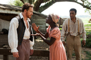 12 Years a Slave, Edwin Epps (Michael Fassbender), ignores the pleas of his slave, Patsey (Lupita Nyong'o)